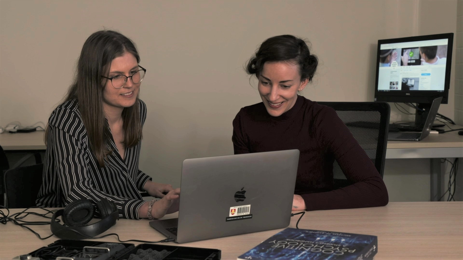 Grant winner Chloe Smith looking at a computer and working.